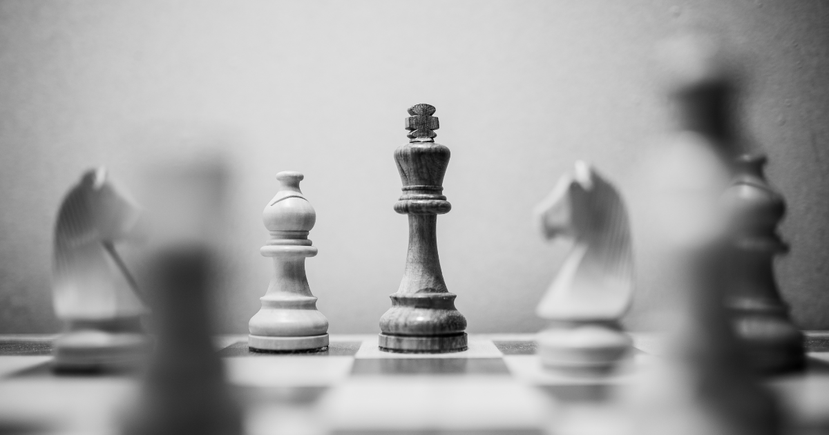 a chess board with the king in focus to show Elevating Your Career: The Transition from Management to Leadership with a Career Coach