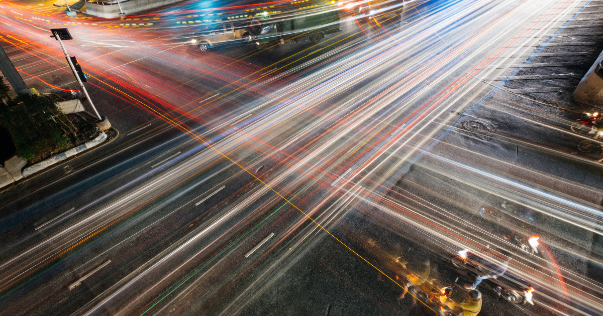 an intersection of a busy street at night showing Why High School Students Need a Career Coach: Navigating the Post-Graduation Maze