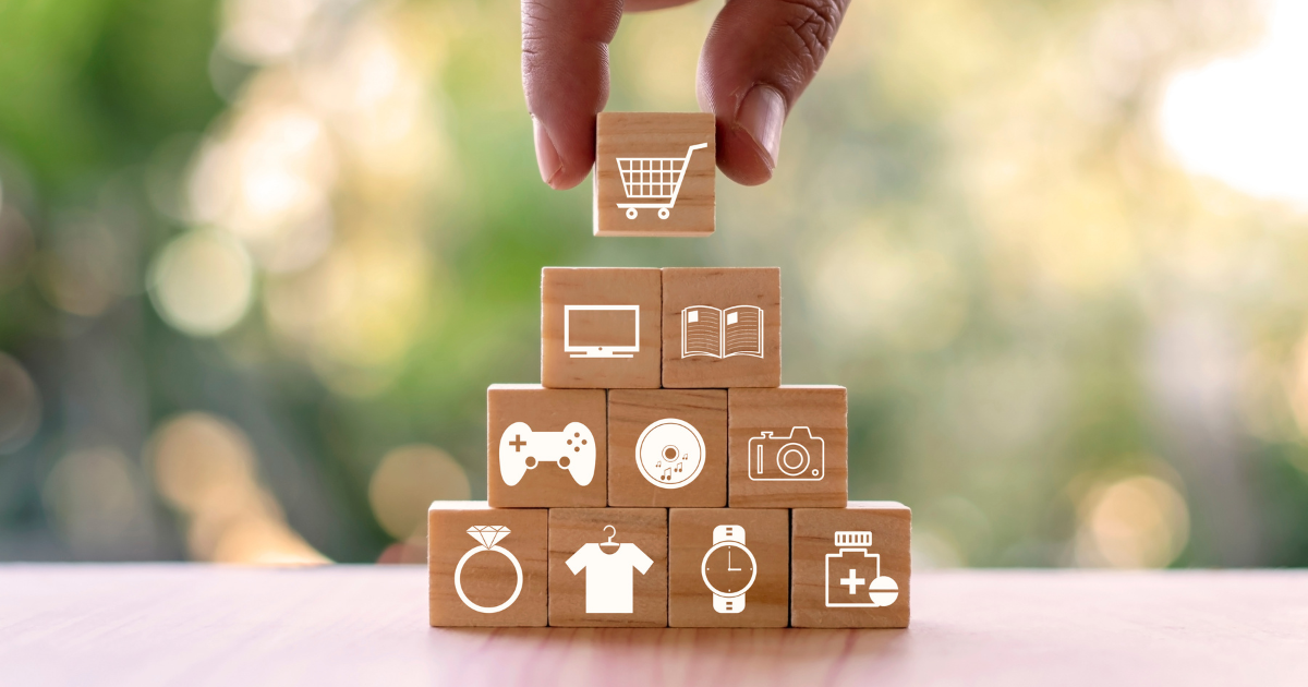 A stack of blocks marked with symbols of household items to show Why High School Students Need a Career Coach: Navigating the Post-Graduation Maze